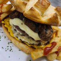 Monster Burger with Fries · 3 layers, 100% ground-beef, Swiss cheese, grilled mushrooms and mustard on a grilled bun.