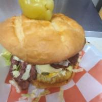 Pastrami Burger with Fries · Pastrami, pickles, mustard, lettuce and tomatoes on a grilled bun with banana peppers.