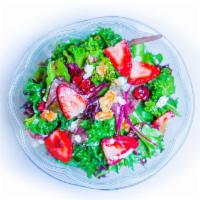 Summer Strawberry Salad · Strawberries, walnuts, craisins, house mix with red wine vinaigrette.