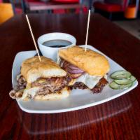 Prime Rib Dip Sandwich · Thinly sliced ribeye, Swiss, grilled onions, served with au jus.