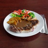 Ribeye Steak · Served with salad, mashed potatoes, and bread.