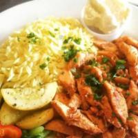 Shawarma Chicken Plate · Chicken roasted on a rotating spit marinated in Sababa's home made sauce. Served with garlic...