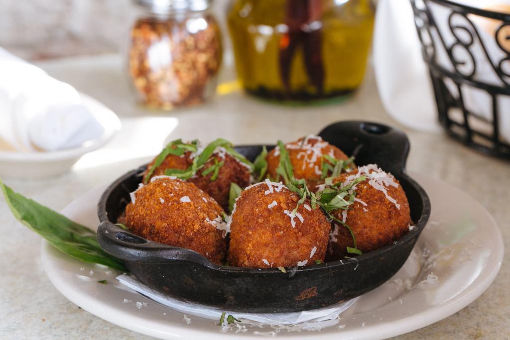 Risotto Balls Plate · Stuffed with mozzarella cheese and mushrooms served with marinara sauce.