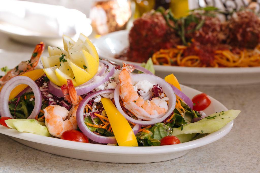 Mediterranean Salad · Mixed greens, red onions, grape tomatoes, yellow peppers, olives, feta cheese and shrimp in our house dressing.