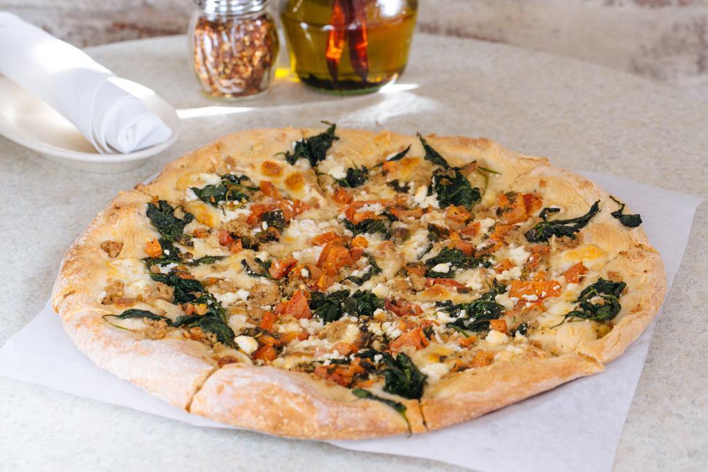 The Sausage Pizza · Medium 13”. 4 cheeses, chicken sausage, Roma tomatoes and spinach.