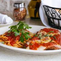 Chicken Parmesan · Breaded chicken breast, lightly fried, and oven baked with mozzarella cheese in marinara sau...