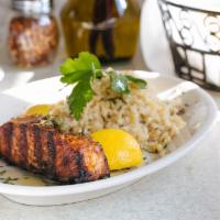 Atlantic Salmon · Simply grilled topped with lemon, olive oil, and capers served with mushroom risotto.