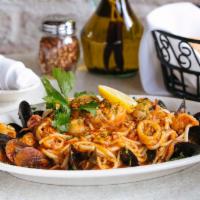 Fra Diavolo Pasta · Shrimp, calamari, salmon, chopped clams, and mussels, in a spicy marinara sauce over linguin...