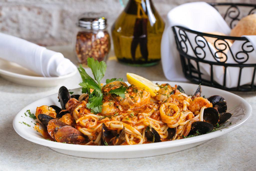 Fra Diavolo Pasta · Shrimp, calamari, salmon, chopped clams, and mussels, in a spicy marinara sauce over linguine pasta.