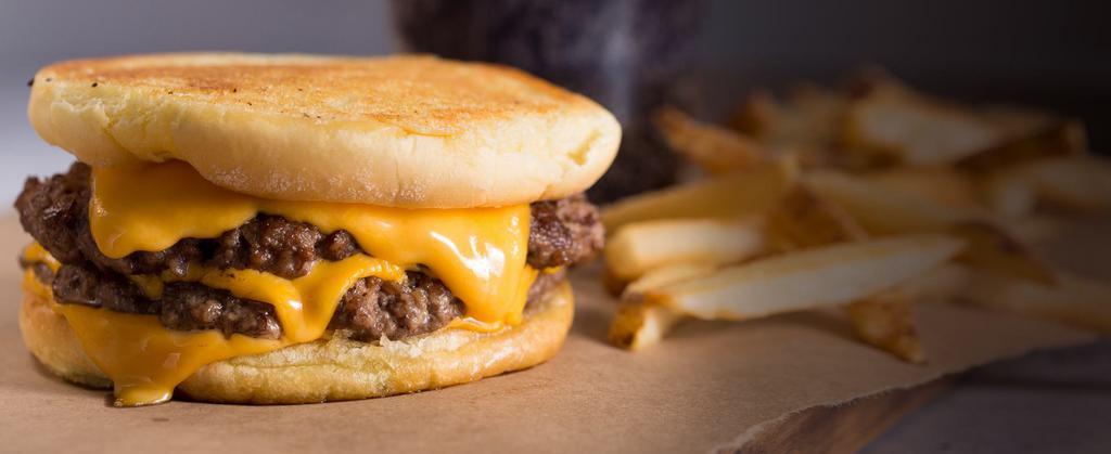 Cheeeesy Burger · We encourage to pronounce all four E’s when ordering. Four slices of melted American cheese and 2 beef patties sandwiched between an inverted, grilled-buttered bun.