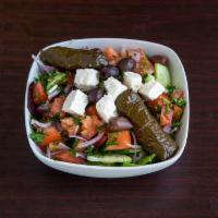 Greek Dinner Salad · Tomato, cucumber, onion, parsley and topped with olives, feta cheese and special dressing.