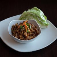 2. Lettuce Wraps · Minced chicken, water chestnuts and green onions in a light brown sauce.
