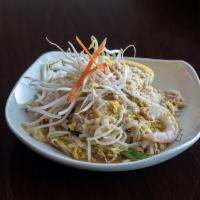 39. Pad Thai · Sauteed rice noodles with eggs, bean, sprouts and green onions, top with crushed peanuts, le...