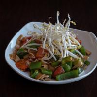 42. Drunken Noodle · Thick rice noodle with fresh Thai basil, green peppers, red peppers, carrots, tomatoes and w...