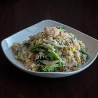 46. Kow Pad · Fried rice with eggs, white onions, peas and carrots.