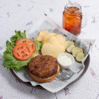 Our Famous Crab Cake Sandwich · Maryland Blue claw crab meat with a mixture of spices & herbs, deep fried to a golden brown ...