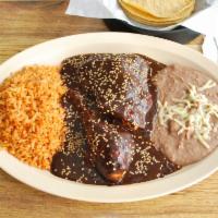 Mole Poblano con Pollo Dinner · Served with rice, beans and salad. 