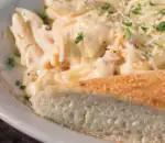 Alfredo Chicken Pasta · Grilled chicken breast with penne pasta tossed in our creamy Alfredo sauce; finished with Parmesan cheese.