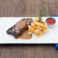 Prime Steak and Frites · 12 oz. NY strip topped, au poivre sauce, served with hand-cut french fries.