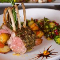 Grilled French Rack of Lamb · Herb seasoned full rack of lamb, sauteed spinach, roasted potatoes and au jus.