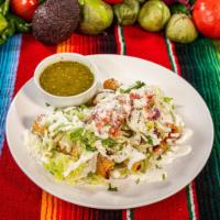 Tacos Dorados  · Four deep fried corn tortillas filled with shredded chicken, topped with lettuce, pico de Ga...