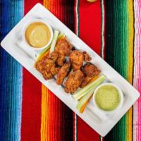 Mexican Chicken Wings  · Six deep-fried, bone-in wings served naked with carrots & celery sticks. Served with homemad...