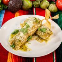 Tamales  · Wrapped in corn husks, filled with shredded chicken and topped with tomatillo salsa, shredde...