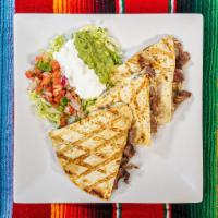 Quesadilla  · Large flour tortilla stuffed with cheese and your favorite protein. Served with lettuce, gua...