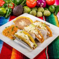 Tacos Gringos  · Three 6 “ tacos filled with ground beef or shredded chicken, choice of soft corn tortilla or...