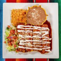 Enchiladas Tijuana · Hand wrapped in fresh corn tortillas, four enchiladas: one ground beef, one shredded chicken...
