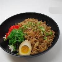 D5. Gyudon Rice Bowl · Marinated and thinly sliced beef brisket cooked with onions, pickled ginger, seaweed salad, ...