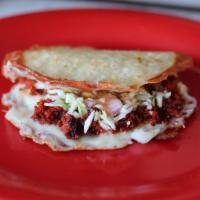 Mulita · 2 corn tortilla with choice of cheese and the meat of your choice in between.