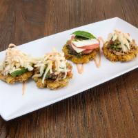 Mini Patacon Sampler · Four crispy fried green plantain with the topping of your choice, tomato sauce (pink sauce) ...