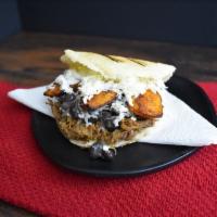 Pabellon Arepa · Grilled corn dough patty (arepa) filled with shredded beef, black beans, sweet plantains, an...