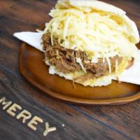 Pelua Arepa · Grilled corn dough patty (arepa) filled with shredded beef and, grated yellow cheese.