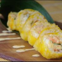 Fancy Salmon Roll · Baked salmon, cream cheese and cilantro, wrapped with soybean paper and tempura fried, toppe...
