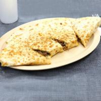 Chicken Quesadilla · Cooked tortilla that is filled with cheese and folded in half. 