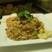R4. Pineapple Fried Rice · Fried rice seasoned with yellow curry powder with choice of meat, pineapples, egg, cashews, ...