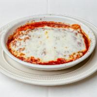 Cannelloni Dish · 3 Pasta tubes stuffed with three cheeses, spinach, chicken, pork, beef and veal. Choose red,...