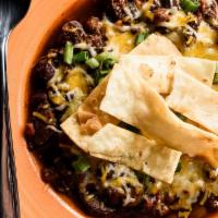 Cantina Chili · Chorizo sausage, beef, pinto and black beans, chipotle peppers and fire-roasted tomatoes. To...