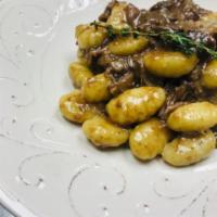 Potato Gnocchi and Oxtail Ragu · Porcini, Marsala and Parmigiano.