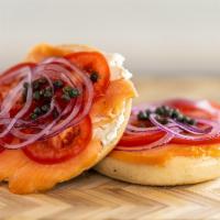The Lox of Love Bagel · Atlantic smoked salmon served with sliced red tomato, red onion, capers and cream cheese on ...
