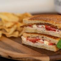 Turkey Club · Buttered sourdough bread, turkey, bacon, swiss cheese, tomato slices and mayo