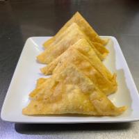 10 Fried Crab Cheese Wonton · Crab rangoons. Stuffed with crabmeat, celery, cream cheese, and onion.