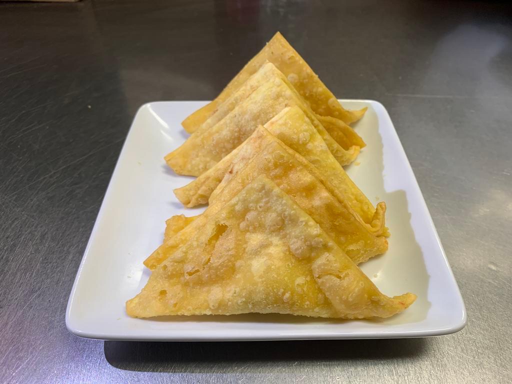 10 Fried Crab Cheese Wonton · Crab rangoons. Stuffed with crabmeat, celery, cream cheese, and onion.