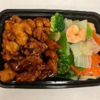 S17. Dragon & Phoenix · Shrimp mixed with Chinese vegetable and chunk chicken fried in spicy sauce. Spicy.