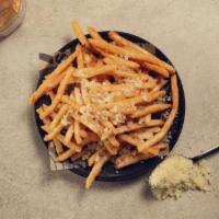 Manchego Fries with Truffle oil · Housemade crispy golden fries topped with manchego cheese and truffle oil.