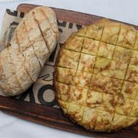 Tortilla Espanola · Traditional omelet from Spain with potatoes, eggs and onions.