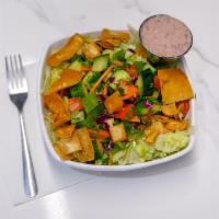 Fatoush Salad · Lettuce, parsley, red onions, cucumbers, tomatoes, topped with fried pita chips & house made...