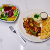 Marinated Chicken Plate · Seasoned chicken breast with char-grilled vegetables, rice, and our creamy garlic sauce. Ser...